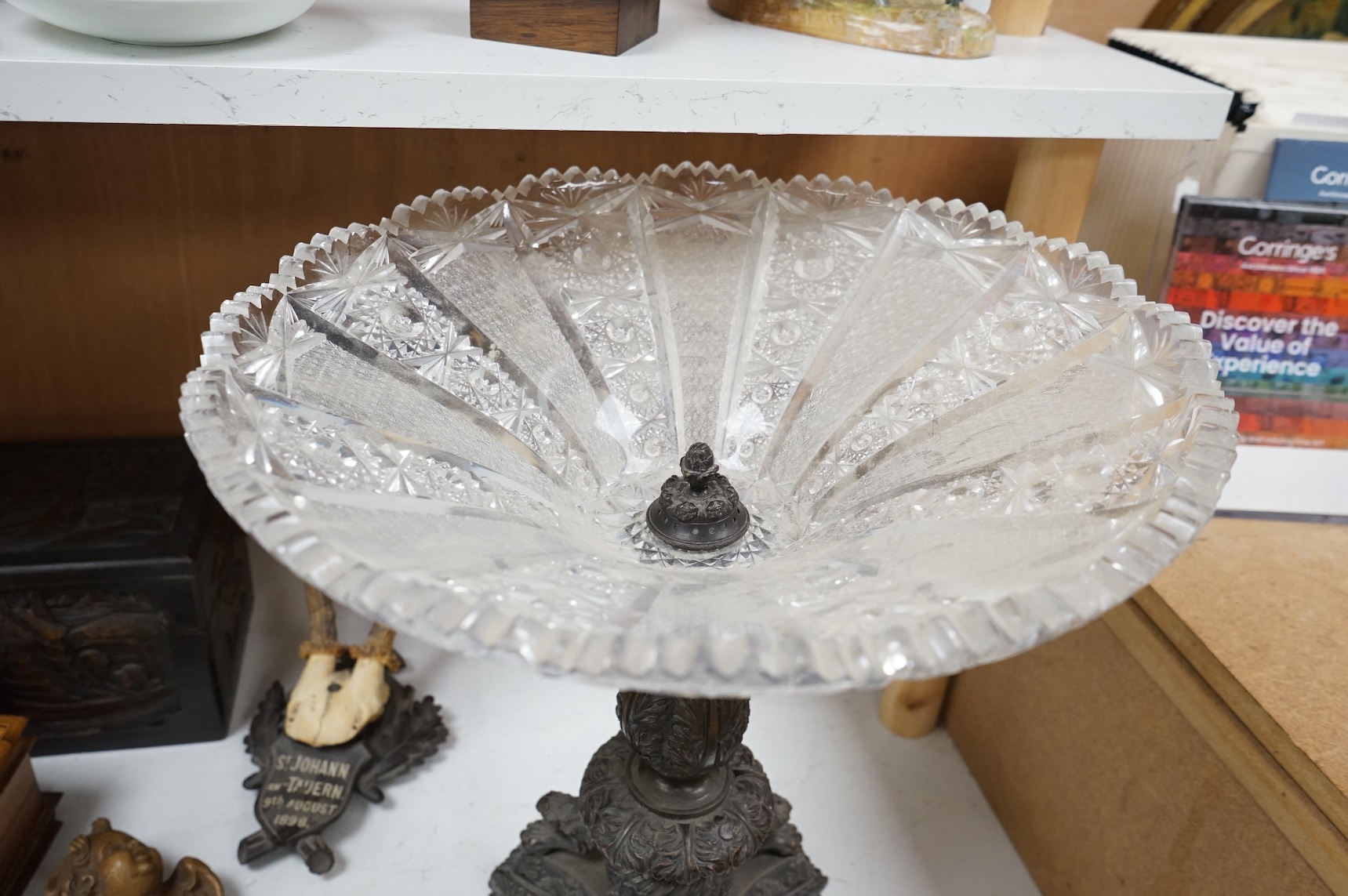 A large cut glass tazza, on bronze tri-form pedestal base, 39cm high.